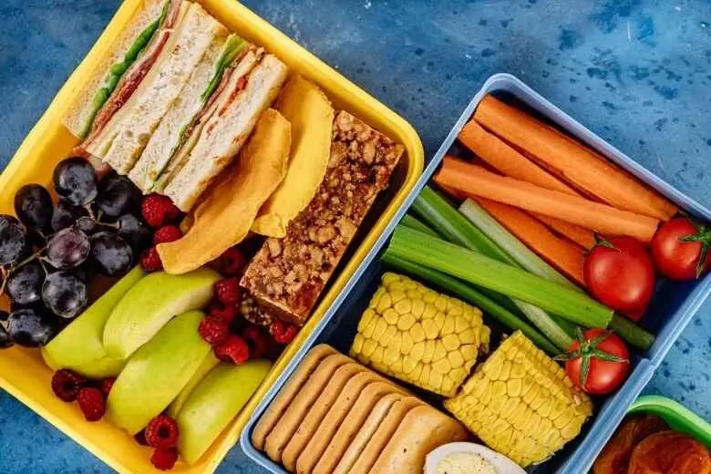 Children eat their favorite lunch as part of tips for children's first day of school to be confident